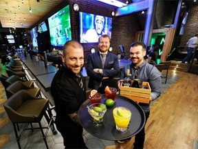 From left, bartender Justin Taylor, bar manager Andrew Young and bartender Shaun Layton in the newly renovated Shark Club in Vancouver.
