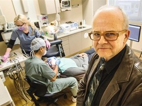 Dr. Michael Flunkert, right, and Dr. Peter Kim, at work on a patient in the background, aren’t happy that B.C.’s dental college restricts them from inspecting the teeth of their spouses and friends.