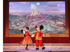 Mickey Mouse and Minnie Mouse, dressed in traditional Chinese costumes, dance for the crowd at the official groundbreaking ceremonyfor the Shanghai Disney Resort in Shanghai, China in 2011. The $5.5 billion US Shanghai Disney Resort is expected to open in 2016.