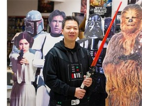 Middle school teacher Lawrence Mak in his Maillard Middle School classroom surrounded by his Star Wars decorations.