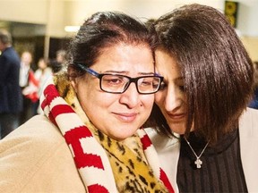Mirna Nakhleh (right) greets her Syrian refugee mother Miriam Hawa as she arrived from Toronto at YVR on Friday.