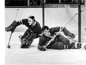 Montreal Canadiens defenceman Serge Savard slides into the  goalpost next to goalie Rogie Vachon on March 11, 1970, fracturing his left leg in five places. While Savard returned to action the next season to resume his Hall of Fame career, his Canadiens would miss the playoffs that spring — the last time there were no Canadian teams in the Stanley Cup playoffs. (Adrian Lunny, Montreal Star)