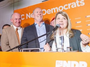 Newly elected MLA Jodie Wickens of the NDP addresses her supporters after winning the byelection for the riding of Coquitlam-Burke Mountain. With her are MLA Mike Farnsworth, left, and NDP leader John Horgan.