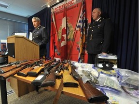 Superintendent Brian Cantera (officer in charge of the RCMP Drug Enforcement Branch) speaks to the assembled media while Terrace RCMP Inspector Dana Hart looks on in Surrey, September 24, 2012, regarding a series of seach warrants executed in the Terrace area.  The results of the raids by the Federal Drug Enforcement Branch were 110 guns, cocaine, marijuana, ecstasy and over $40,000 in cash, along with one man, Dave Edwardsen, charged with 11 drug trafficking and firearm related offences.