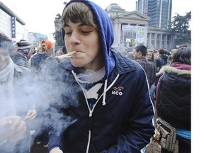 A teen smokes in front of the Vancouver Art Gallery on April 20, 2011. With a week to go before this year’s 4/20 “smoke out,” the Vancouver school board is hosting a free public forum called Teens and Cannabis in the auditorium of Vancouver Technical Secondary School.