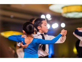 Fraternal twins Leanne Chang and Ronald Chang during a ballroom dancing competition.