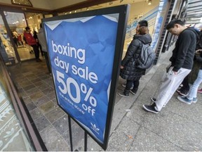 File: Shoppers hit Vancouver's downtown streets early on December 26, 2013 to take in the Boxing Day sales.
