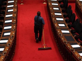 Floors are swept before B.C. Finance Minister Michael de Jong tables a balanced budget for a fourth year in a row at the Legislative Assembly, in Victoria on Tuesday, Feb. 16, 2016.
