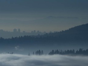 Fog enshrouds the Lower Mainland, as seen from Burke Mountain in Coquitlam, BC Friday, January 1, 2016.