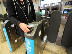 Landon Poato, 24, an SFU student tap out with the Compass card at Waterfront station, Sept. 30, 2015. TransLink plans to phase out the paper version of its monthly pass by Jan. 1, in a bid to get all passholders to transfer to the electronic Compass card.