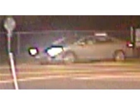Police are looking for the driver of this car, seen shortly after a fatal hit and run on 200th St. on Dec. 20.