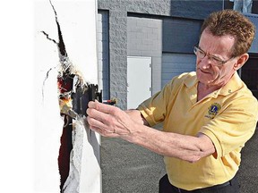 Langley Lions member Paul Keeris checked out the damaged door where thieves broke into the club's trailer. They looted the equipment used to serve up charity fundraising meals.