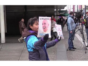 A Megaphone vendor sells magazines on a Vancouve street on Thursday, february 4, 2016.