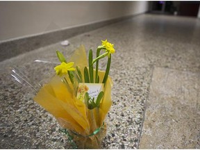 Flowers, with a hand written 'Welcome to Vancouver' card sit in the entrance of the Muslim Association of Canada offices on Saturday.