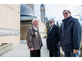 Shawkat Hasan, Daud Ismail and David Ali, left to right discuss outside the Masjid al-Salaam mosque in Burnaby, B.C. Sunday November 22, 2015 the sponsorship of Syrian refugees and settling them in Metro Vancouver.