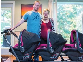 Mahalia Meeuwsen and her husband Mike show off their new stroller, nicknamed the "train" for their expected identical triplet girls, in Salmon Arm, B.C.