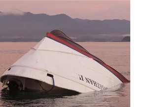 The bow of the Leviathan II that capsized is seen near Vargas Island Tuesday, October 27, 2015 as it waits to be towed into Tofino, B.C.