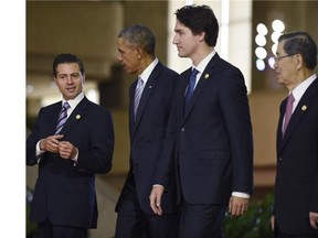 Prime Minister Justin Trudeau with U.S. President Barack Obama, second from left, Mexico's President Enrique Pena Nieto, left, and Taiwan's envoy Vincent Siew at Asia-Pacific Economic Cooperation summit in November.
