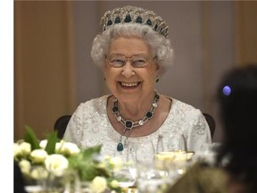 Queen Elizabeth II smiles as she attends a dinner at the Corinthia Palace Hotel in Attard during the Commonwealth Heads of Government Meeting.