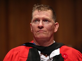 Retired Canadian Forces Captain Trevor Greene, receives an Honorary Doctor of Education degree from the University of Victoria, marking his advocacy and inspiration for brain injury survivors at the University of Victoria in Victoria, B.C., Tuesday, November 10, 2015.