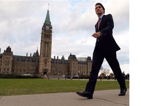 Justin Trudeau makes his way from Parliament Hill to the National Press Theatre to hold a press conference in Ottawa on Tuesday, October 20, 2015.