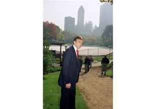 Donald Trump waves to the crowd gathered in front of Trump Tower.