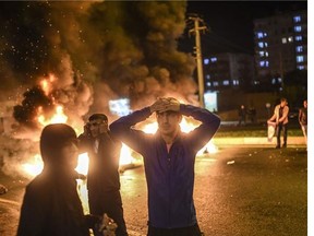 People celebrate preliminary election results of the pro-Kurdish Peoples's Democratic Party (HDP) in Diyarbakir, in Turkey's predominantly Kurdish southeast, late Sunday, Nov. 1, 2015.