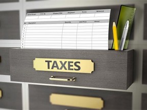 Office drawers with text on the subject of taxes. Photo by fotolia.com.