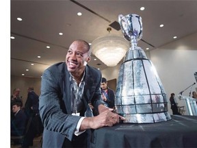 Ottawa Redblacks quarterback Henry Burris looks at the Grey Cup during the team breakfast on Thursday, Nov. 26, 2015, three days ahead of Sunday’s 103rd CFL Grey Cup championship game against the Edmonton Eskimos in Winnipeg.