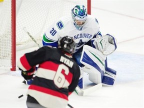 Ottawa Senators right wing Bobby Ryan shoots on Vancouver Canucks goalie Ryan Miller during first period NHL action Thursday November 12, 2015 in Ottawa.