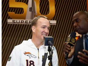 Peyton Manning #18 of the Denver Broncos talks with Marshall Faulk at Super Bowl Opening Night Fueled by Gatorade at SAP Center on February 1, 2016 in San Jose, California.