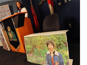 A photo of slaying victim Lianjie Guo is displayed in the foreground at a 2012 press conference.