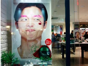 Popular South Korean actor Kong Yoo appears in a cosmetics advertisement in the Myeongdong shopping district of Seoul.