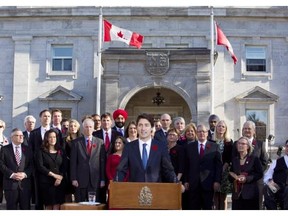 Prime Minister Justin Trudeau holds a news conference with his cabinet after they were sworn-in at Rideau Hall, the official residence of Governor General David Johnston, in Ottawa, on November 4, 2015. Now comes the hard part as the rookie prime minister and his team confront the reality of delivering on Trudeau’s promises of “real change.”