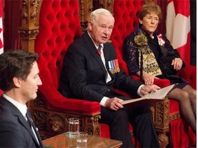 Prime Minister Justin Trudeau and Sharon Johnston listen as Governor General David Johnston delivers the speech from the throne in the Senate Chamber on Parliament Hill in Ottawa on Friday. THE CANADIAN PRESS/Sean Kilpatrick