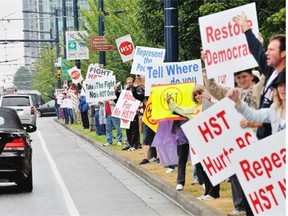 HST protesters line Georgia Street in downtown Vancouver between Denman and Stanley Park in 2010 to voice their opposition to the tax, which was axed after a majority of B.C. residents voted to repeal it.