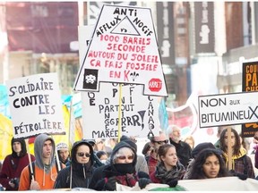 Protestors demonstrate against the Energy East and Line 9B Pipelines during a rally in Montreal.