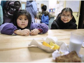 Rayea and Em-Jay enjoy breakfast at Strathcona Community Centre, adjoining Strathcona Elementary School. The program is supported by Adopt-A-School donations.