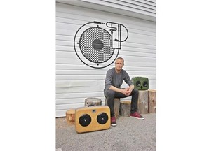 Retired athlete Jay DeMerit with some of his custom-made stereos.