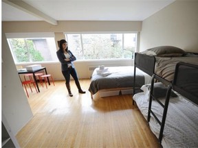 Rhiannon Mabberley, a project manager for developer Westbank, looks over a newly furnished suite in Vancouver last month that was to be used as transitional housing for Syrian refugees.