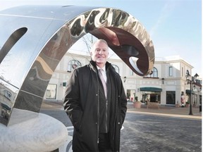 McArthurGlen Designer Outlet GM Robert Thurlow in action in front of the facility's locally-created huge whale, which has become a selfie icon with visitors, in Richmond, BC., December 16, 2015.