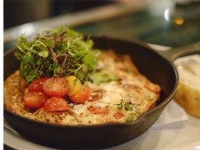 Roasted Oyster Mushroom Frittata with Marinated Tomatoes and Baby Greens.