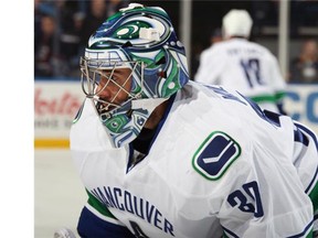 Ryan Miller #30 of the Vancouver Canucks warms up to play the Buffalo Sabres at First Niagara Center on November 7, 2015 in Buffalo, New York.