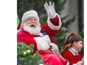 Santa waves to the crowd during the 10th annual Rogers Santa Claus Parade.