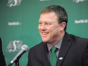 Saskatchewan Roughriders newly signed general manager and coach Chris Jones answers questions at a news conference announcing his hiring in Regina on Monday, Dec. 7, 2015.