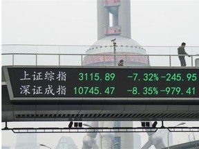 A screen in Shanghai shows Chinese stock prices in steep decline before being brought to a halt on Thursday. It was the second market halt in the four trading days of 2016.