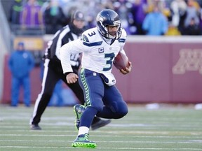 Seattle Seahawks quarterback Russell Wilson (3) runs the ball during the first half of an NFL wild-card football game against the Minnesota Vikings, Sunday, Jan. 10, 2016, in Minneapolis.