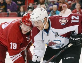 Shane Doan (left) of the Arizona Coyotes and Jarome Iginla of the Colorado Avalanche lean in for position during a November 2014 NHL game in Glendale, Ariz. The veteran stars, teammates on the WHL’s Kamloops Blazers, were both picked in the 1995 NHL Entry Draft.
