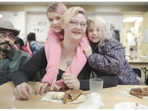 Shawn and Sabrina Moreau and their children Vanda and Andrea (r) at  Strathcona Community Centre. The program is supported by Adopt-A-School donations.