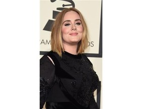 Singer Adele arrives on the red carpet during the 58th Annual Grammy Music Awards in Los Angeles February 15, 2016.